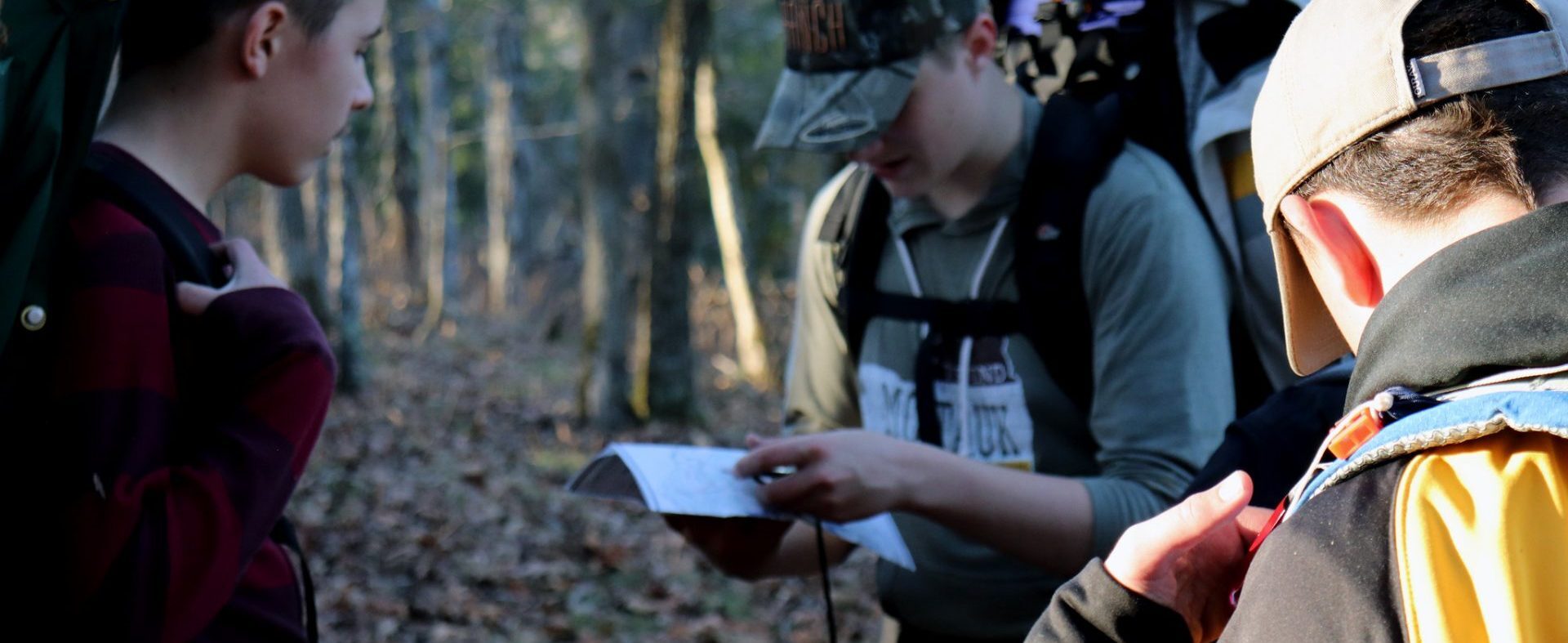 Scouts reading a map outside