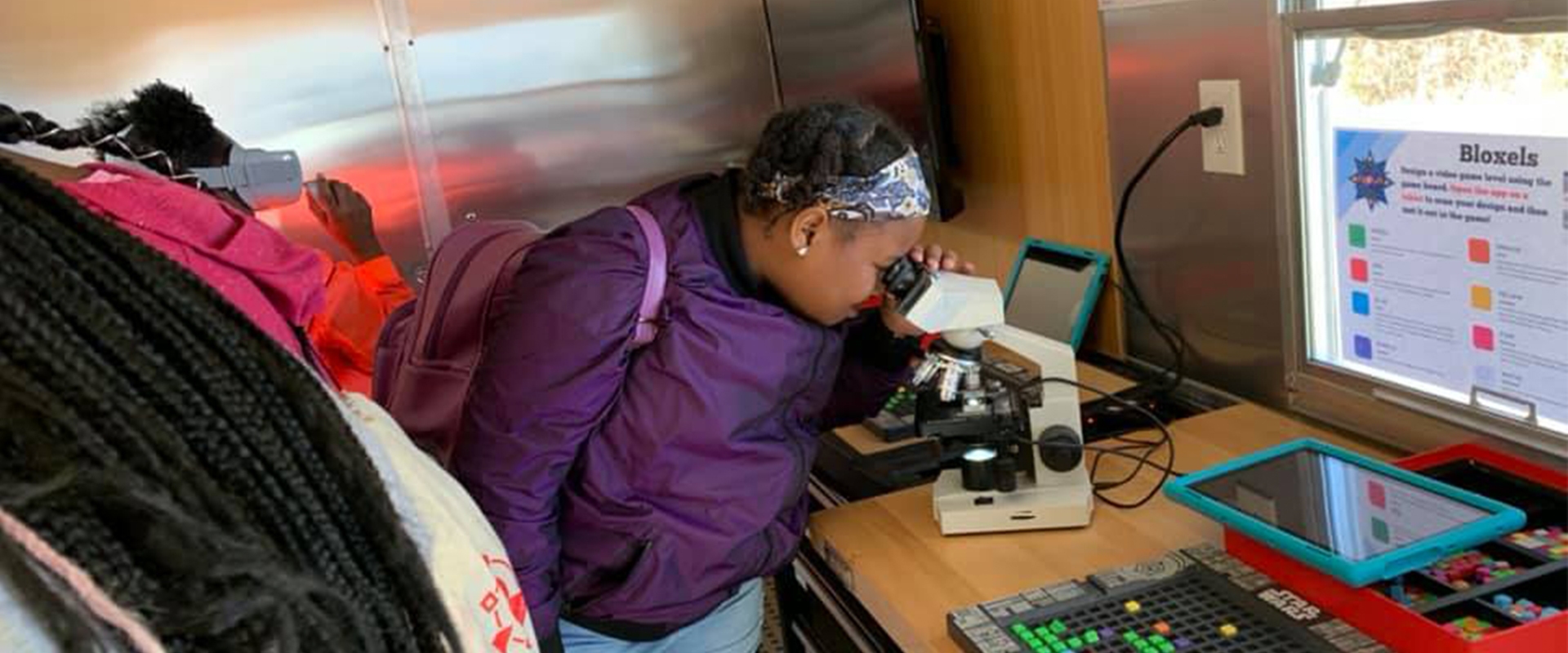 scout looking into microscope photo