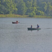 People in boats on a lake